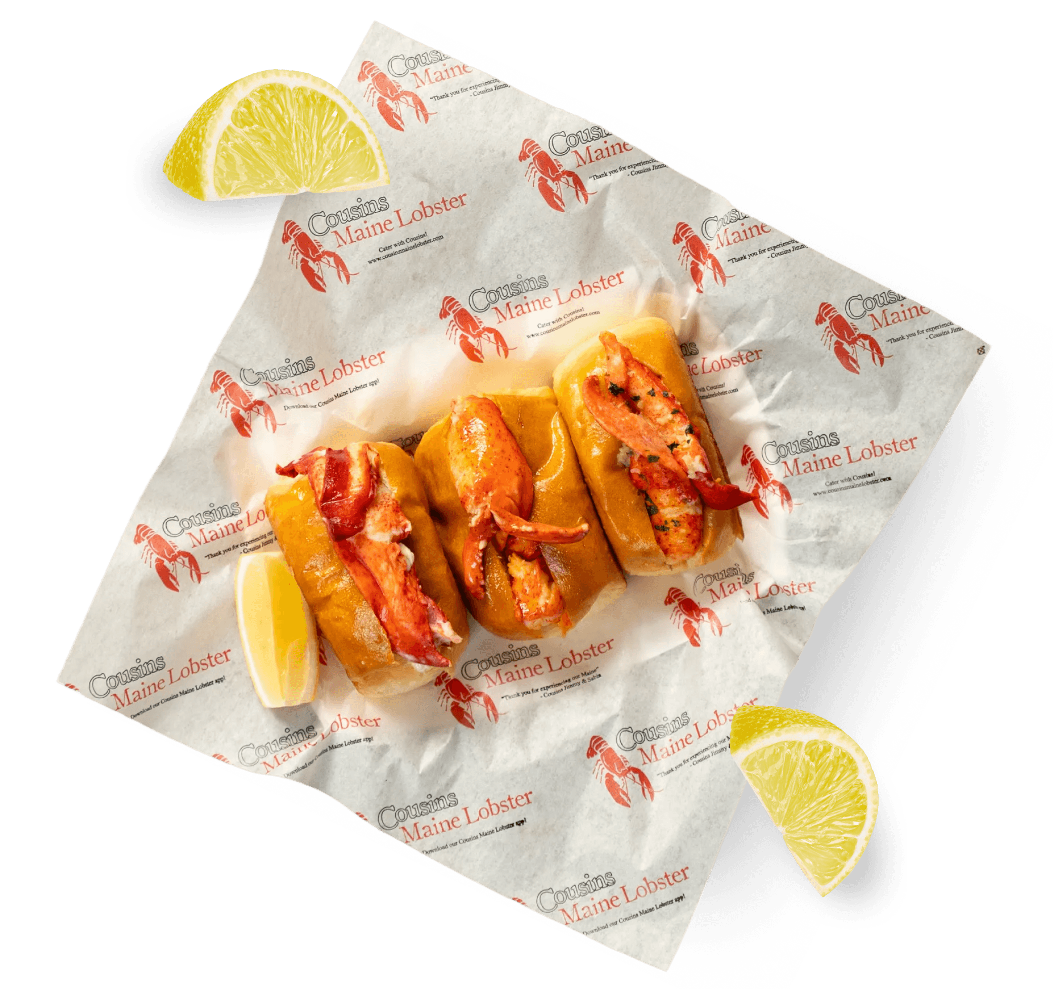 Cousins Maine Lobster roll flight on branded parchment with lemon wedges
